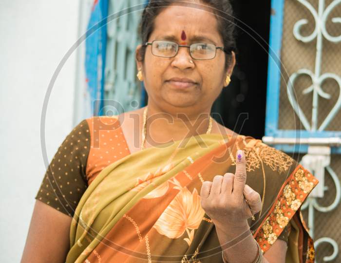 Indian Women Showing Her Voted Finger