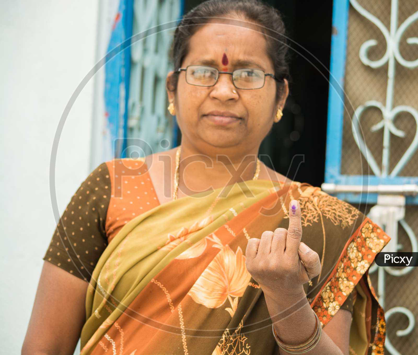 Indian Women Showing Her Voted Finger