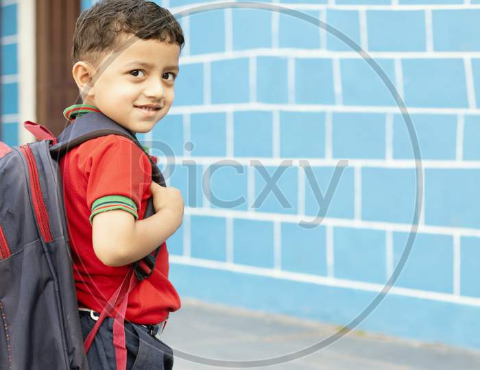 Back To School Concept - Cute Asian Child Boy With Backpack Going To School With Fun