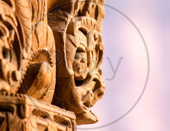 A Stone carved Pillar with Blur Background