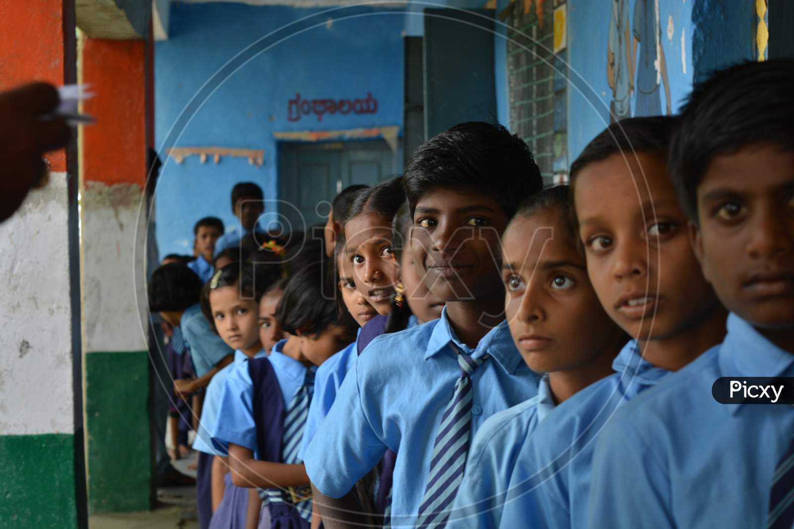 Mernal, Karnataka, India 25 July, 2019 : Government School Children Having Fun While Standing In Que.