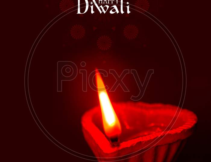 Selective Focus on Lightened Diya / A Concept of Happy Diwali Greetings