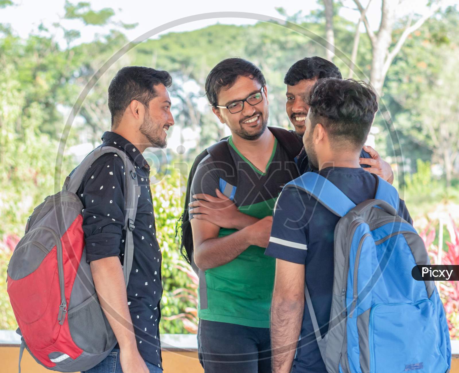A Group of students Talking to each other at A University or College Campus