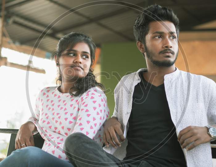 A Young Indian Boy and Girl looking towards the right side