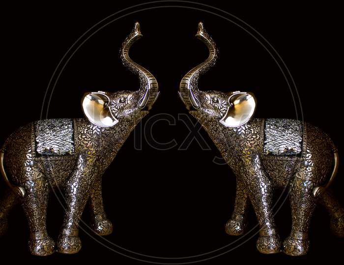 Couple of elephants Toys on black background
