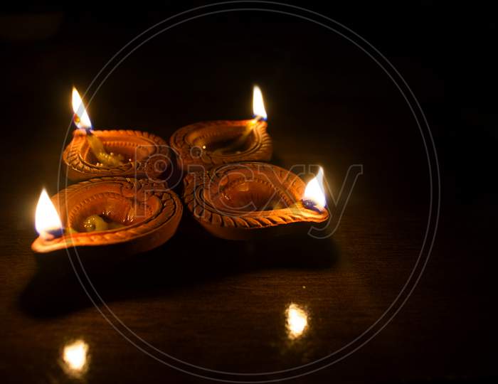 A Lightened Diya's A Concept of Happy Diwali Greetings