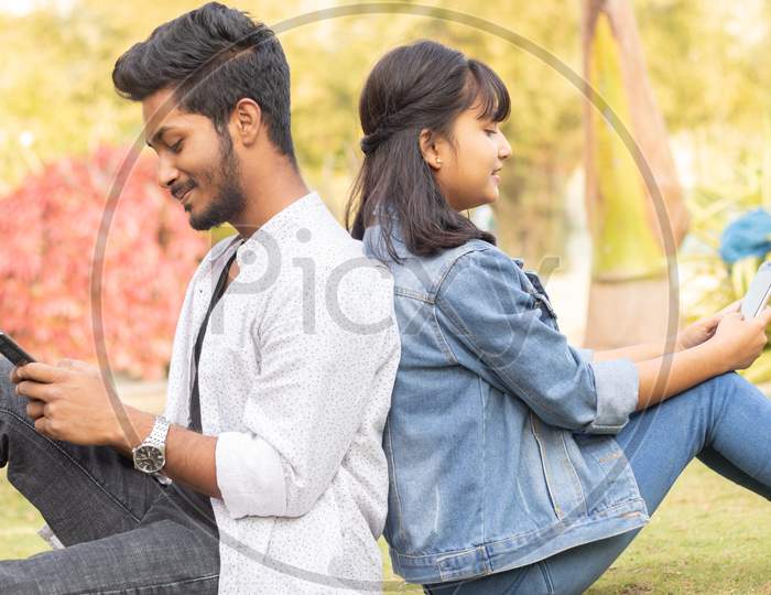 A Young Indian Couple using a Smartphone