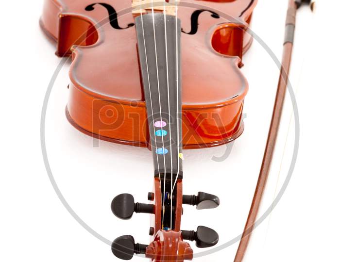 A Small Viola Or Violin And Bow Isolated On A White Studio Background