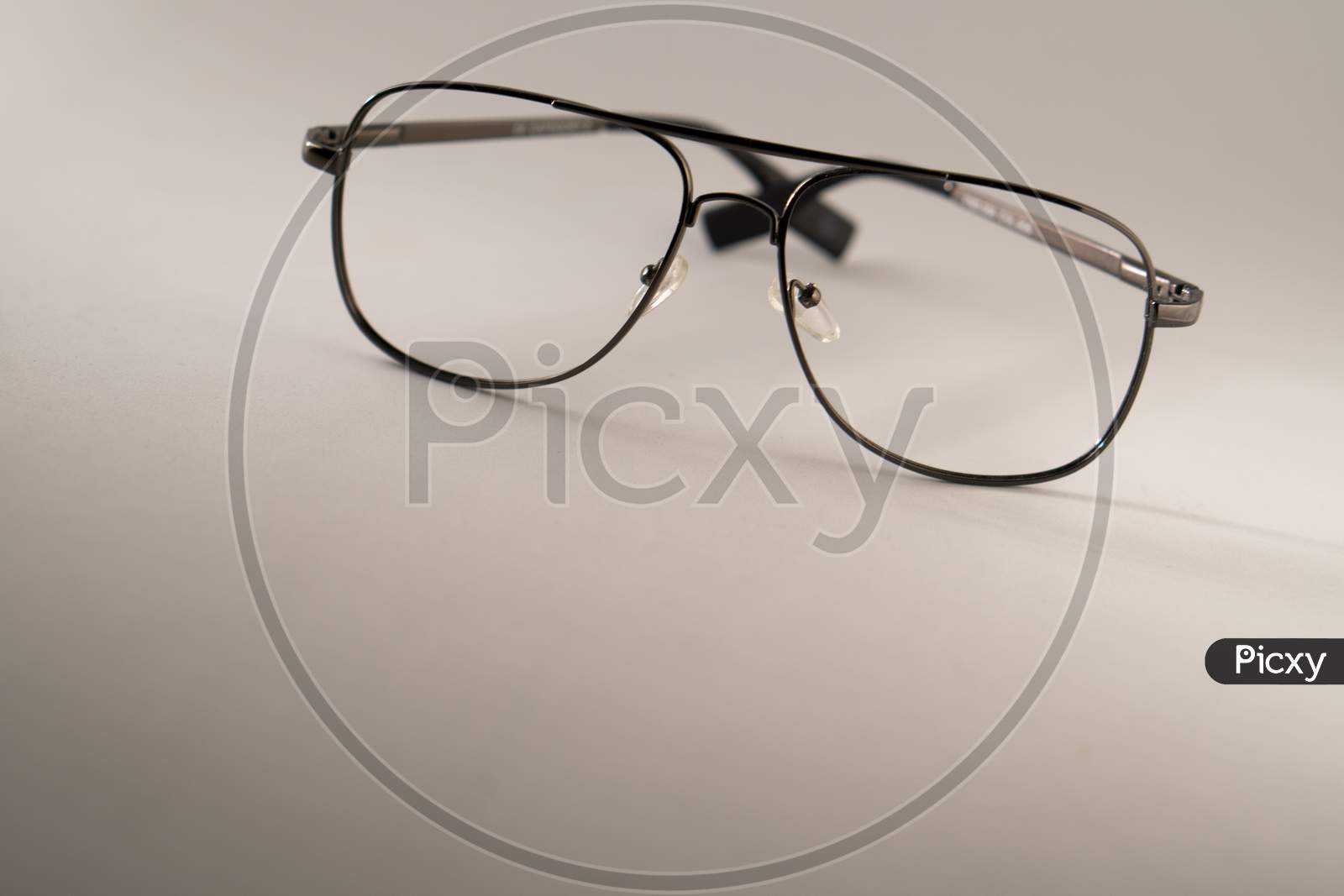 Black frame spectacle (eye glasses) isolated on a white background. Photo has empty space for text.
