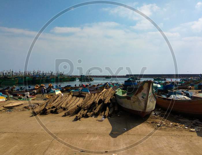 Indian Fishing Boats With Men At Kasimedu Fishing Harbour