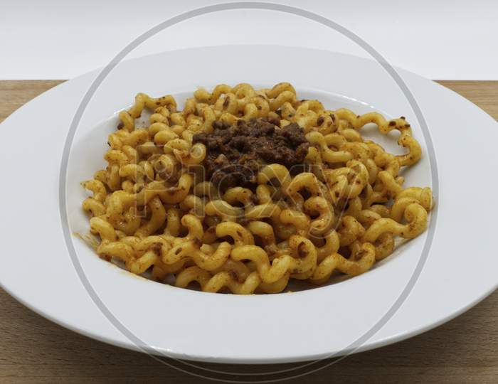 Fusilli Lunghi Bucati with bolognese sauce. Italy