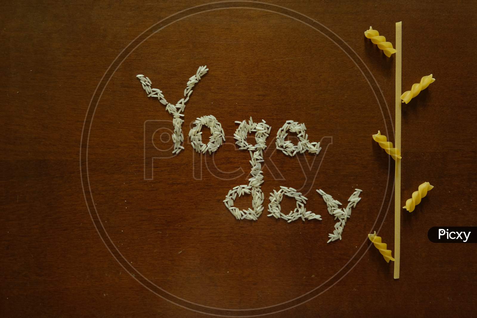 Yoga day  text with rice and spaghetti.