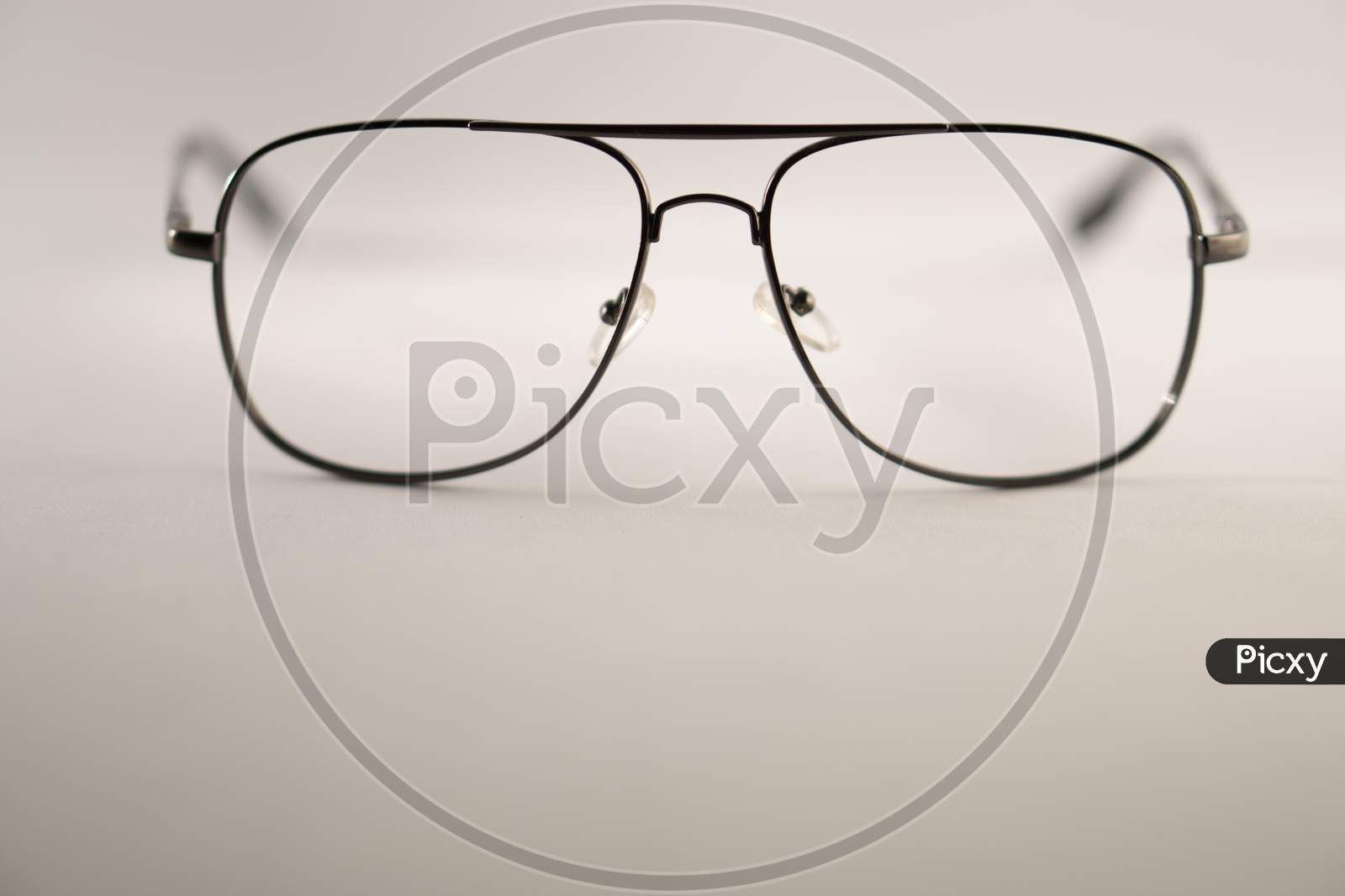 Black frame spectacle (eye glasses) isolated on a white background. Photo has empty space for text.