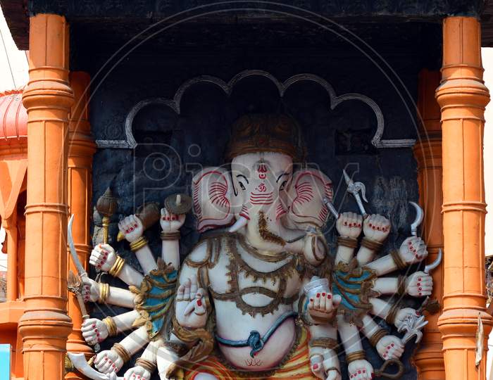 Idol of Lord Ganesha atop the entrance of a temple