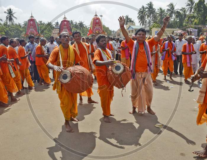 colourful devotees or pilgrims performing during ratha yatra festival at puri odisha