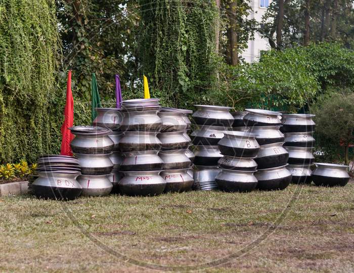 Lots Of Cooking Pot Made With Aluminium Stored On A Field