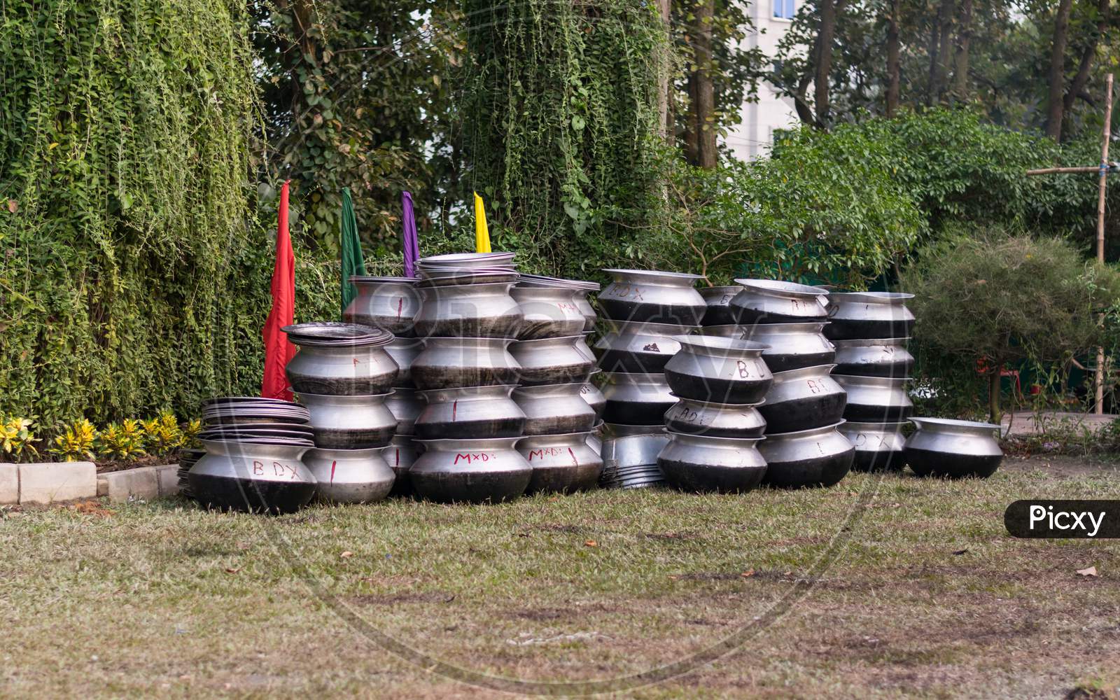 Lots Of Cooking Pot Made With Aluminium Stored On A Field