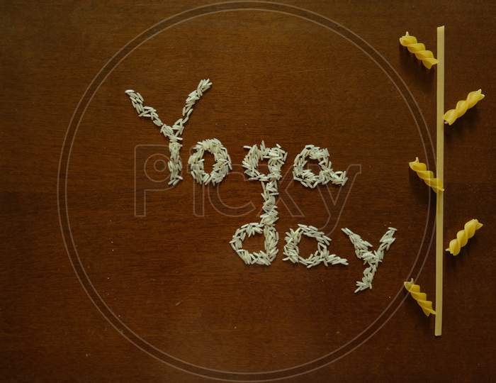 Yoga day  text with rice and spaghetti.