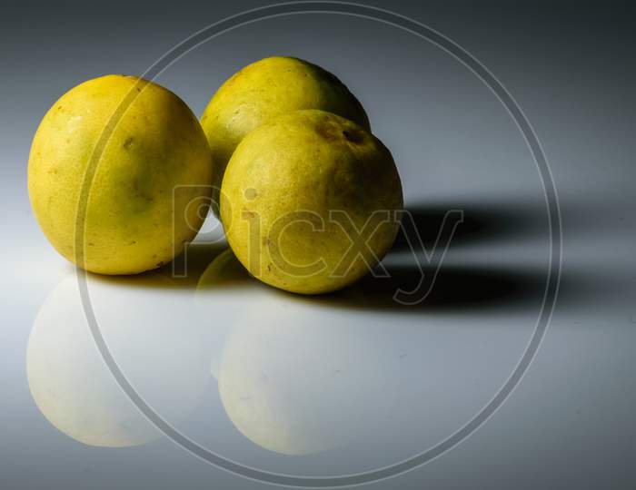 Isolated Lemons Placed In A White Background With Space For Text In The Right