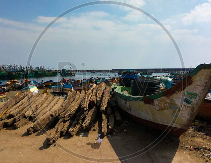 Indian Fishing Boats With Men At Kasimedu Fishing Harbour