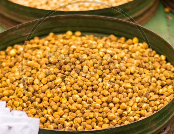 Roasted Chickpeas Displayed On A Green Bowl For Sell In A Road Side Food Van
