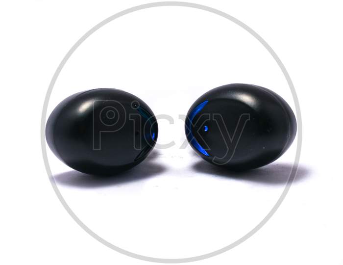 A Pair Of Truly Wireless Earbuds On A Pure White Background With Shadows