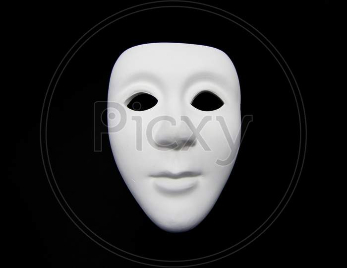 White mask on a black background