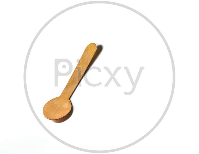 An Isolated Wooden Spoon In A White Background