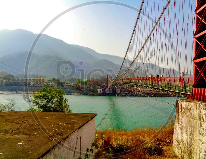 Beautiful Lakshman Jhula Bridge And Ganga River In The Spiritual Town Of Rishikesh, India