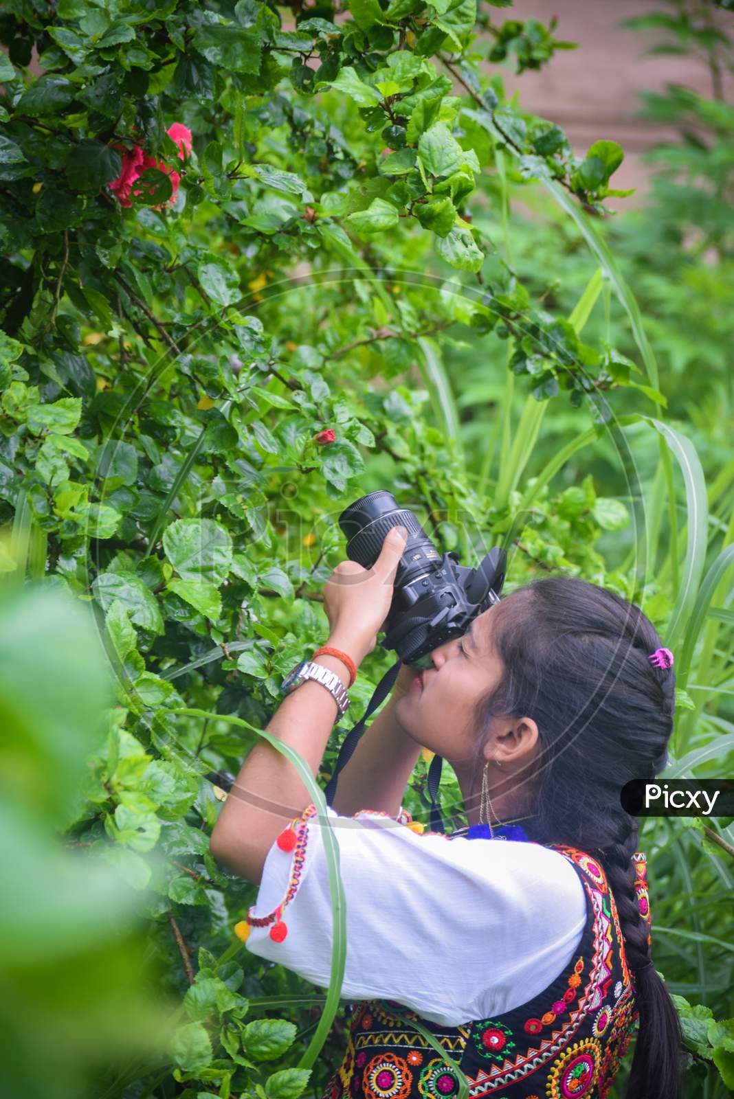 indian female photographer clicking a photo at bara imambara, Lucknow Tourism