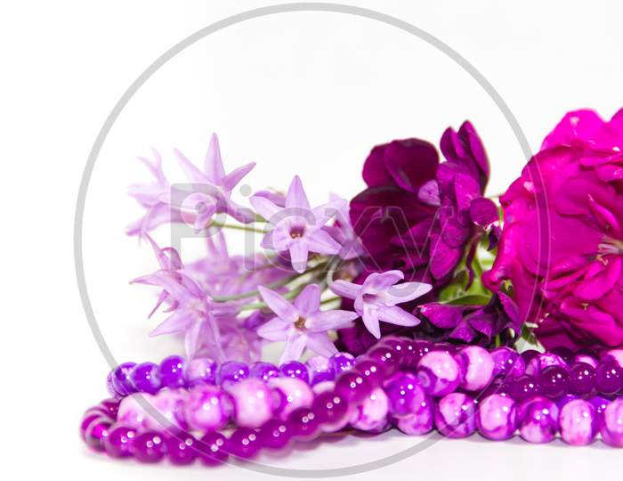 Feminine And Romantic Pearls And Flowers In Violet Tone