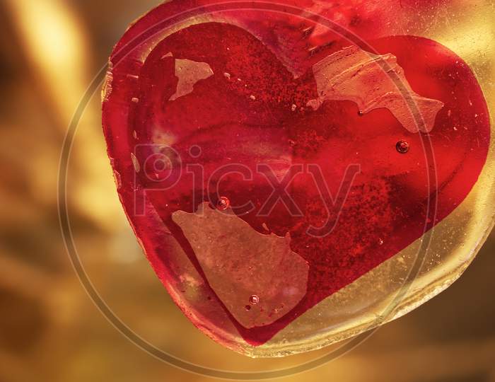 Red Valentines heart in amber.