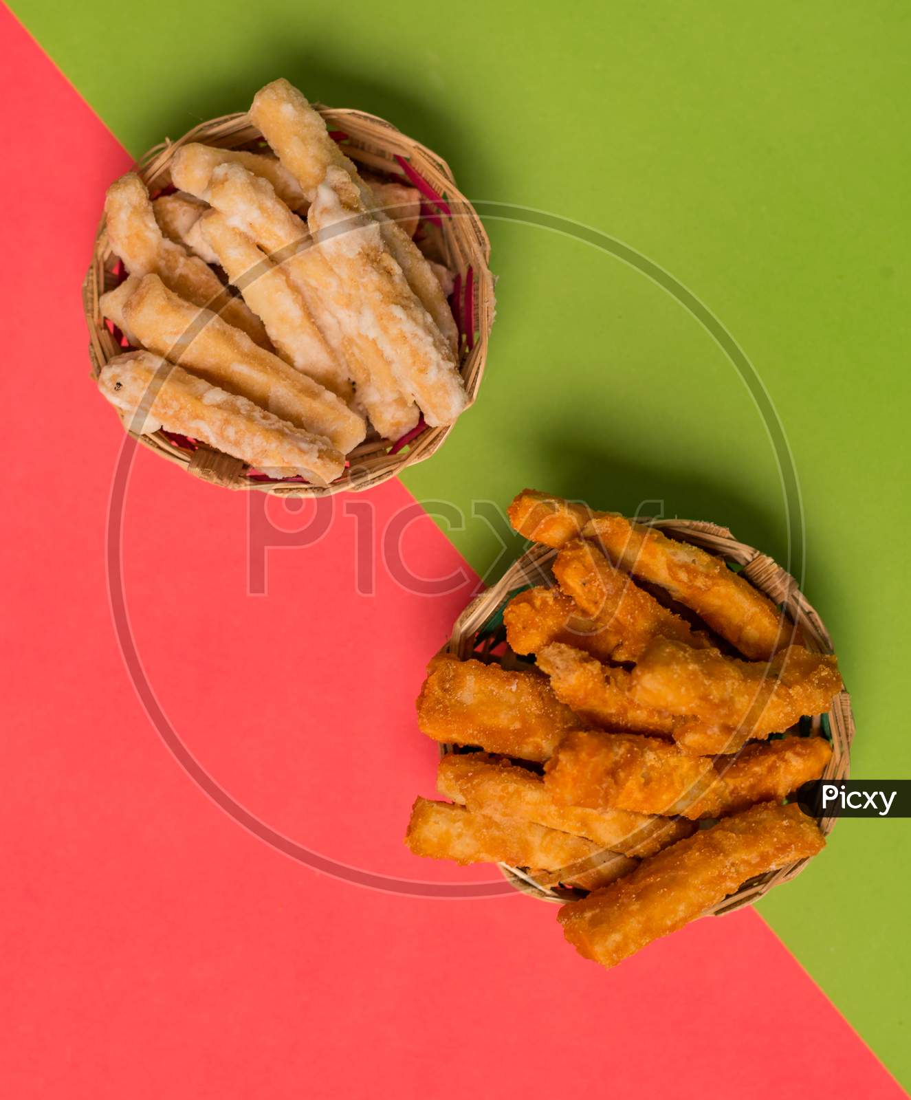Bengali Traditional Sweet Snakes In Plain Green And Red Background