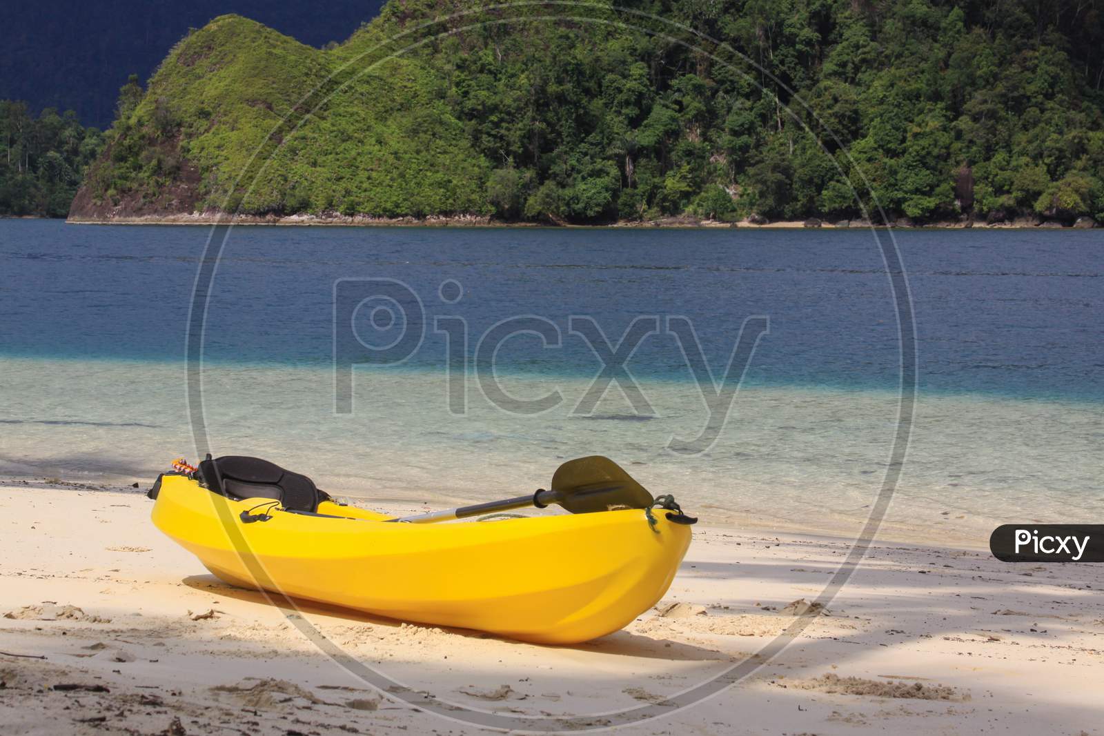 Yellow Kayak On The Beach Of Exotic Tropical Island