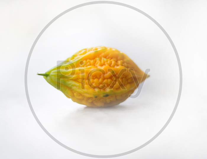 Close up of yellow bitter gourd with isolated background, the vegetables, a healthy diet and medicine.