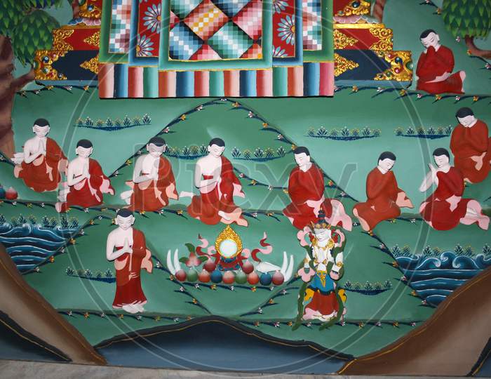 A beautiful Painting of Buddhist monks on the walls of Golden temple in Bylukoppa in Karnataka/India.