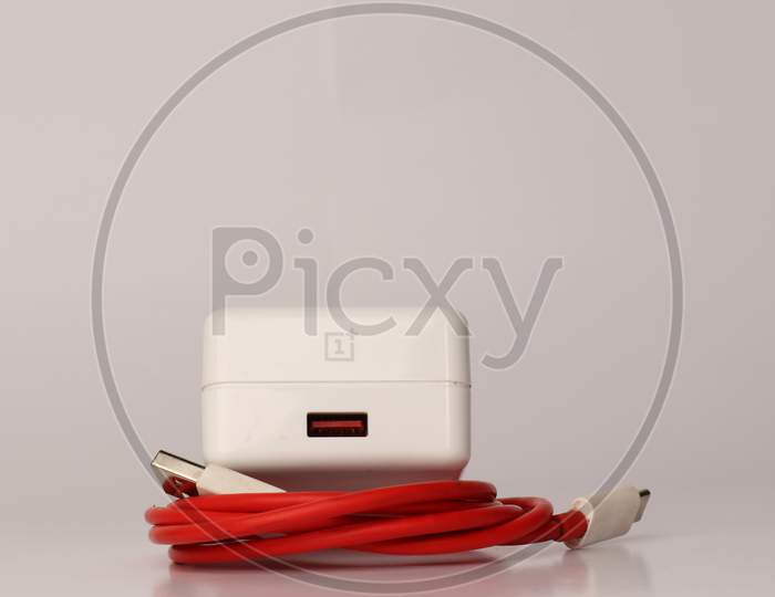 OnePlus dash charger with red cable