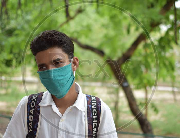 indian man with green mask on face