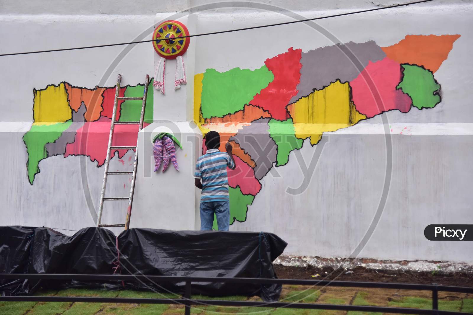 An Artist Paints A Mural - a Wall Map Of Assam In Guwahati , India  On June 14,2020.