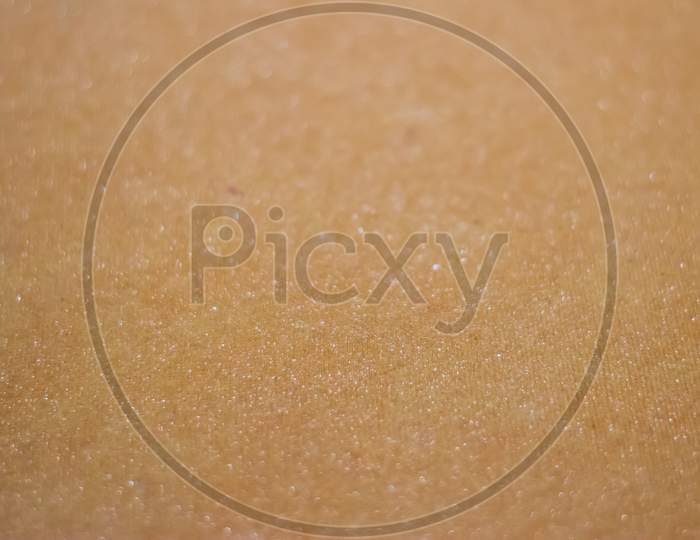 Light brown paper background texture with selective focus