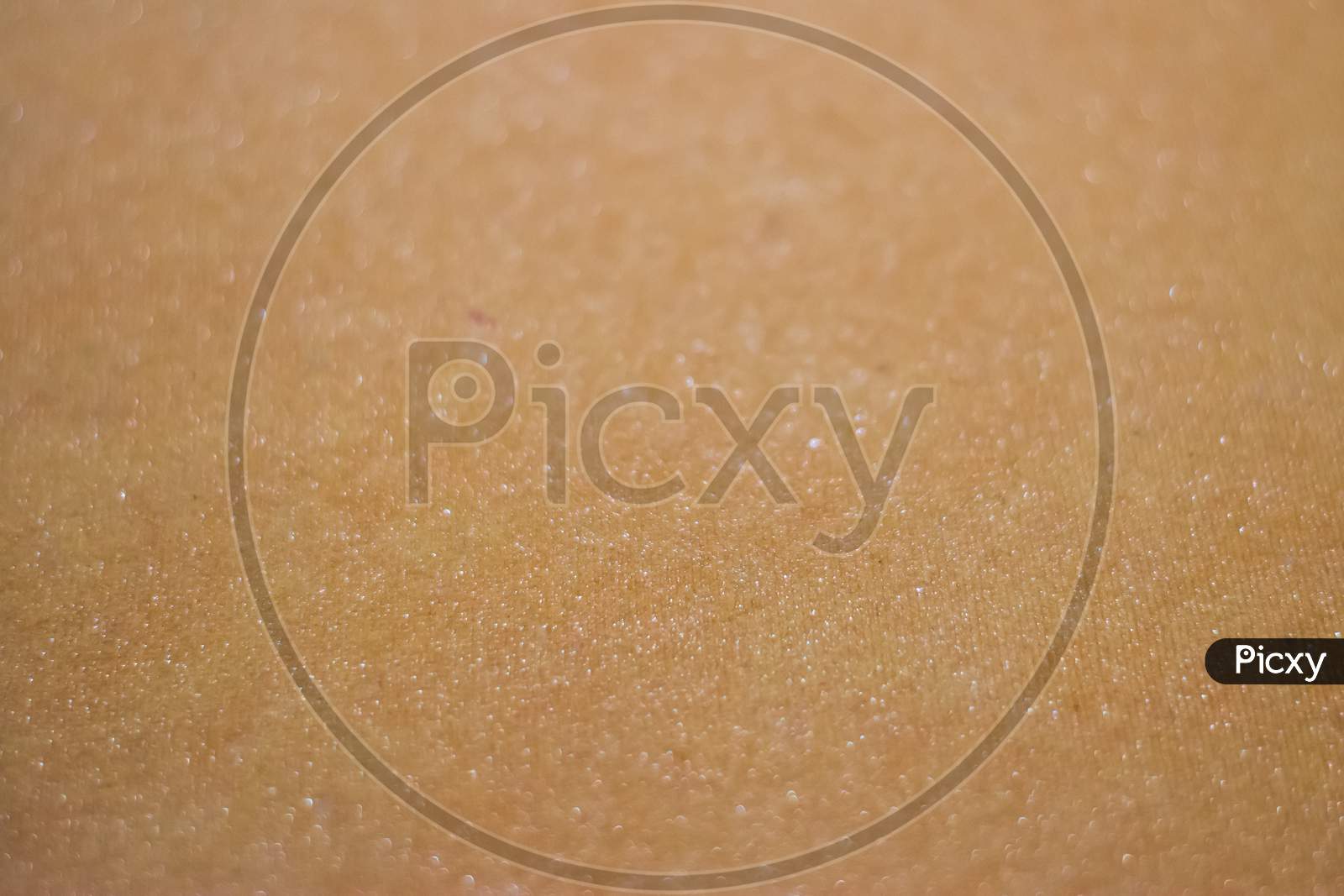 Light brown paper background texture with selective focus