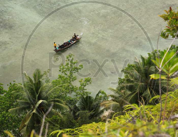 Boat Approaching Shore In Tropical Sea Destination Pasumpahan Island