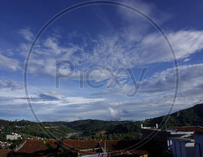 Blue sky with white clouds in the hills