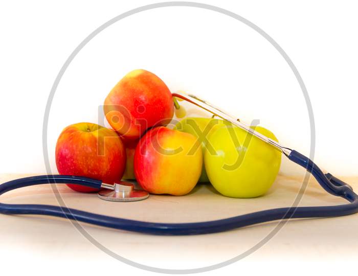 Health Concept With Green And Red Apples And Stethoscope