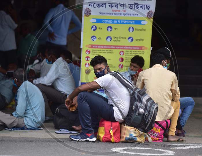 Migrant Workers wait With Their Luggage At the Guwahati Railway Station To Board A Train, After The Government Eased A Nationwide Lockdown Against The Covid-19 Coronavirus, In Guwahati, India On June 14, 2020.