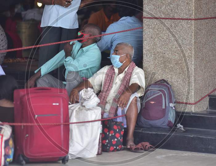 Migrant Workers wait With Their Luggage At the Guwahati Railway Station To Board A Train, After The Government Eased A Nationwide Lockdown Against The Covid-19 Coronavirus, In Guwahati, India On June 14, 2020.