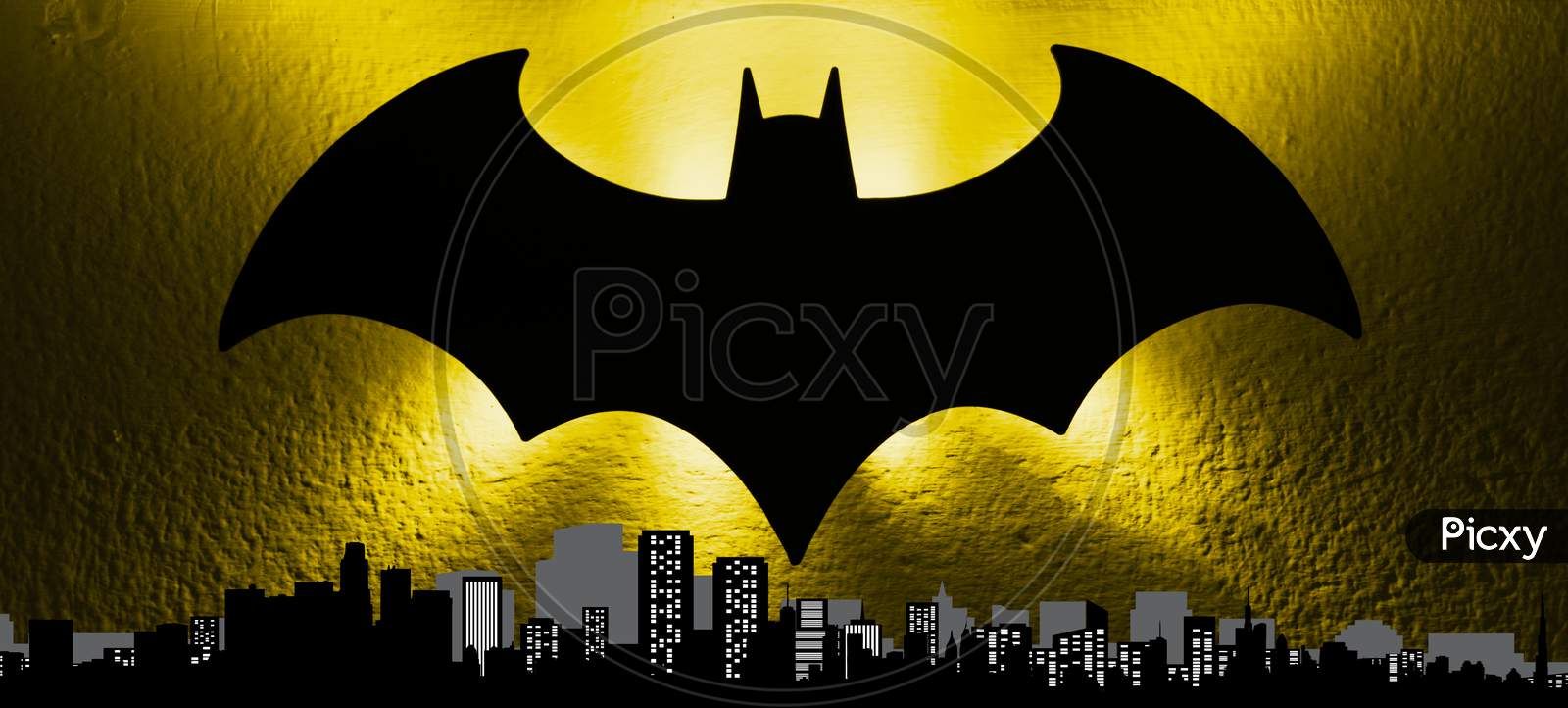 The bat signal light from the Gotham cityscape