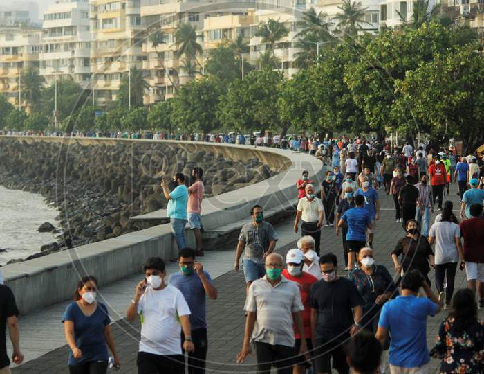 People walk along the promenade at Marine Drive after some restrictions were lifted in Mumbai, India on June 6, 2020.