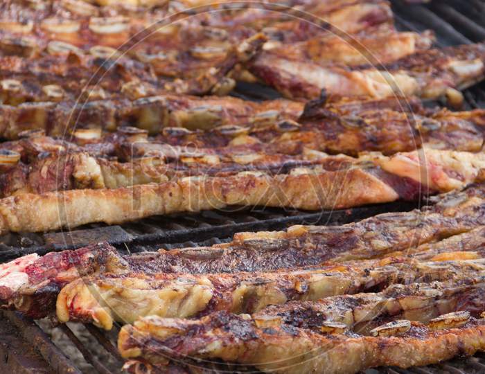Traditional Meat Grilled On The Grill In The Argentine Countryside