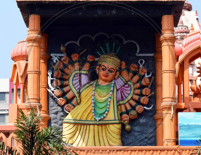 Idol of Goddess Saptashrungi atop the entrance of the Bhaktidham Temple